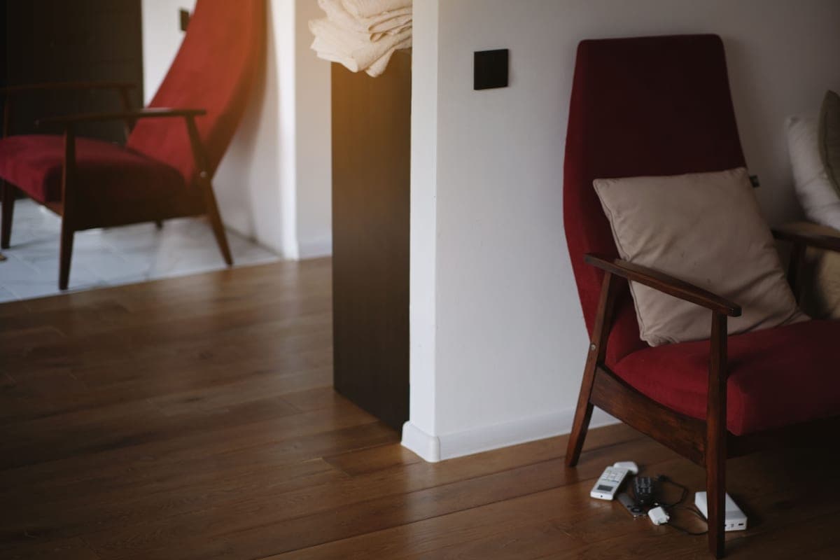 Two similar armchairs placed side by side in a room