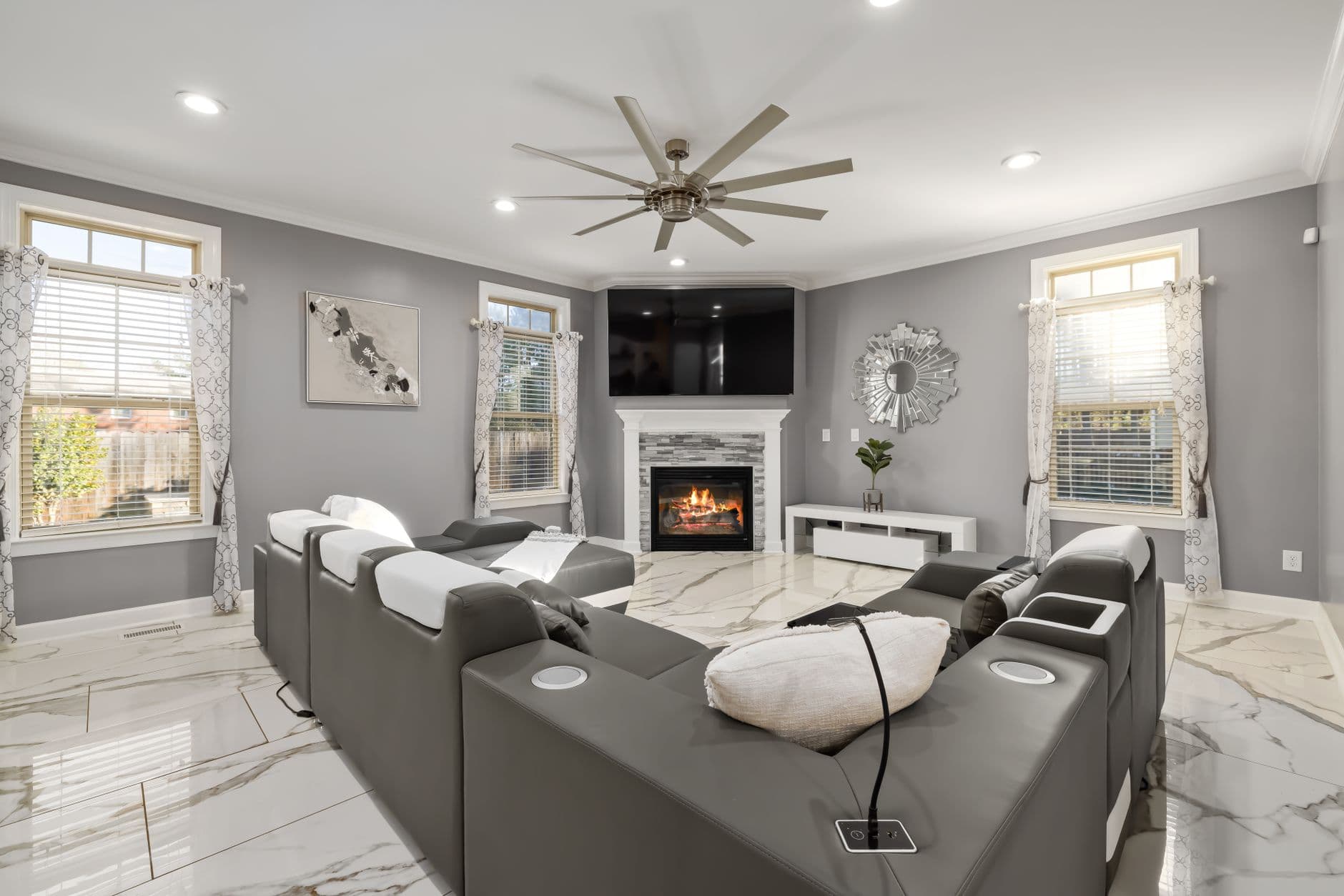 A contemporary living room with a fireplace and sleek furniture