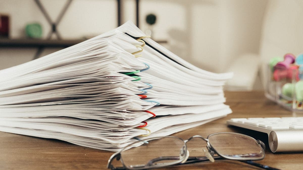 Printed documents stacked on a desk