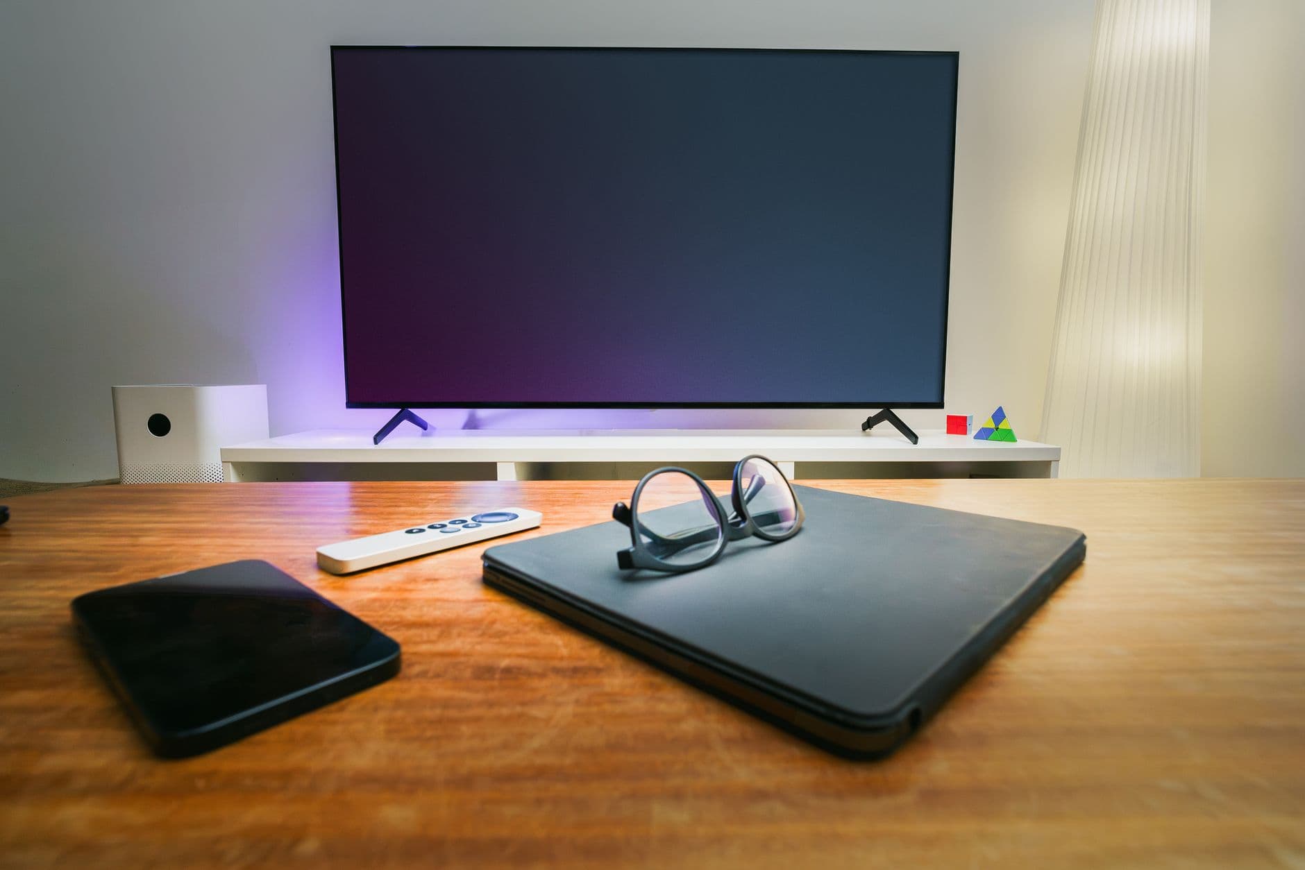 A living room with smart home technology and modern decor