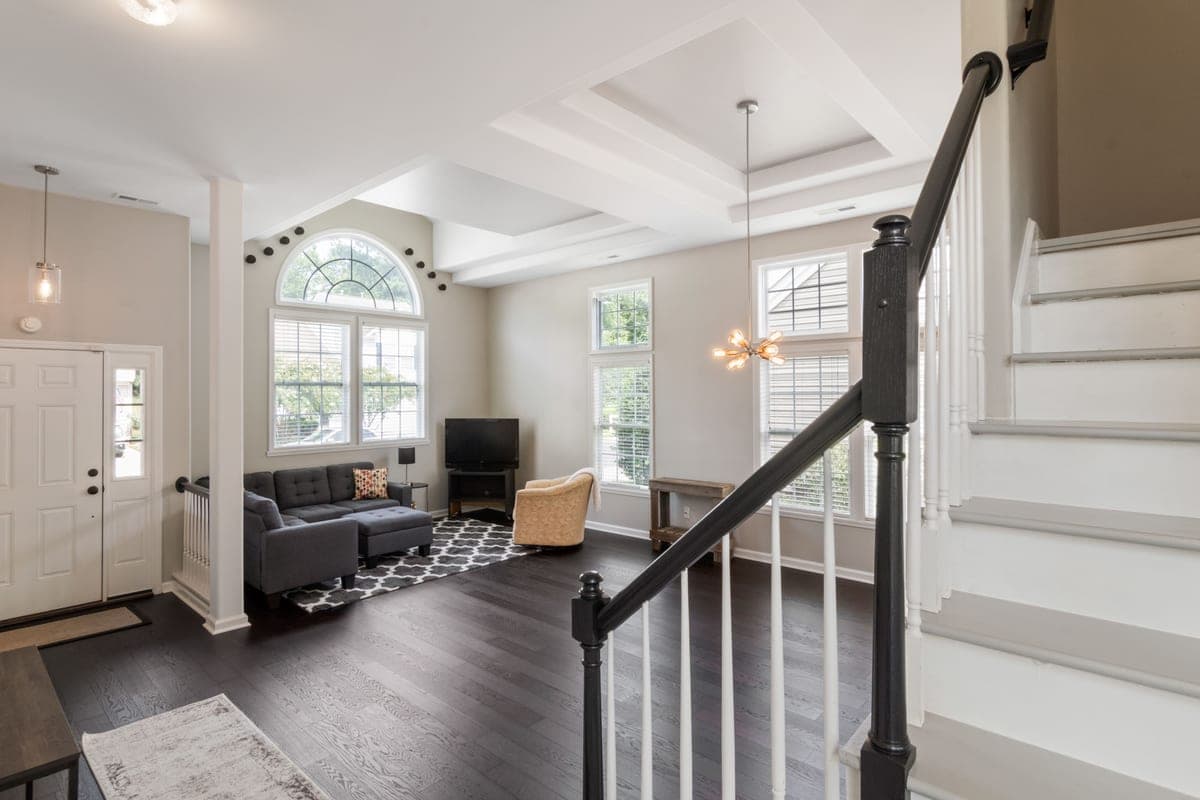 A large open-plan living space with a high ceiling
