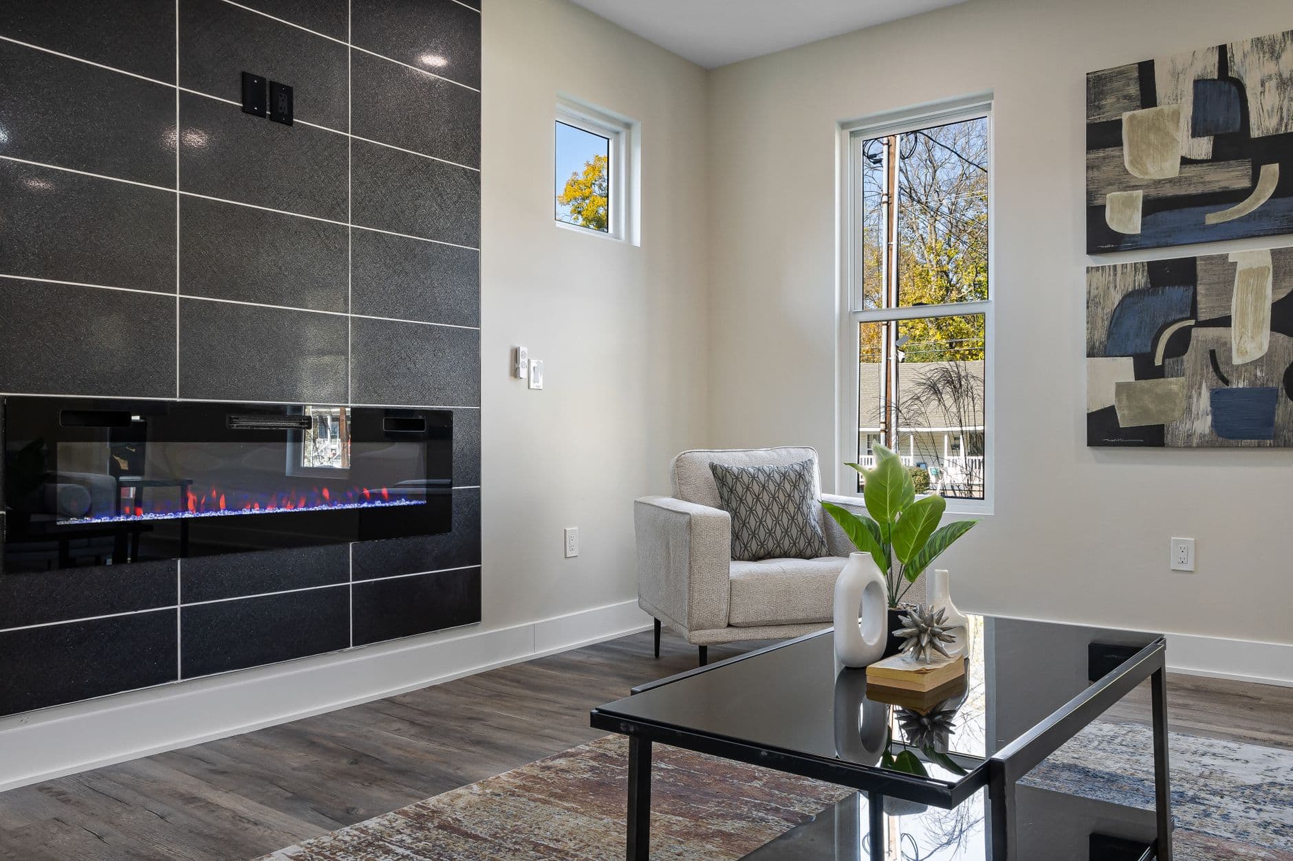 A living room with a fireplace set into a contemporary interior