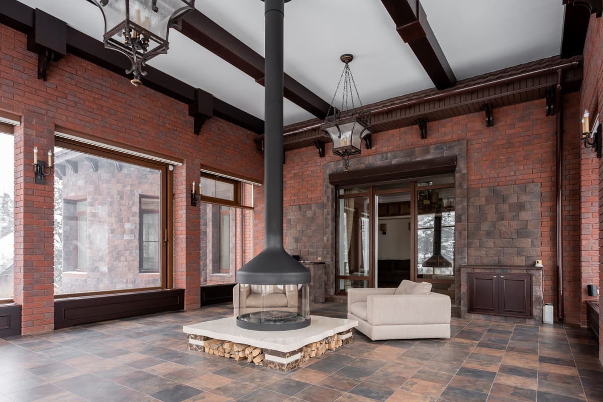 A disused brick fireplace opening in an older room