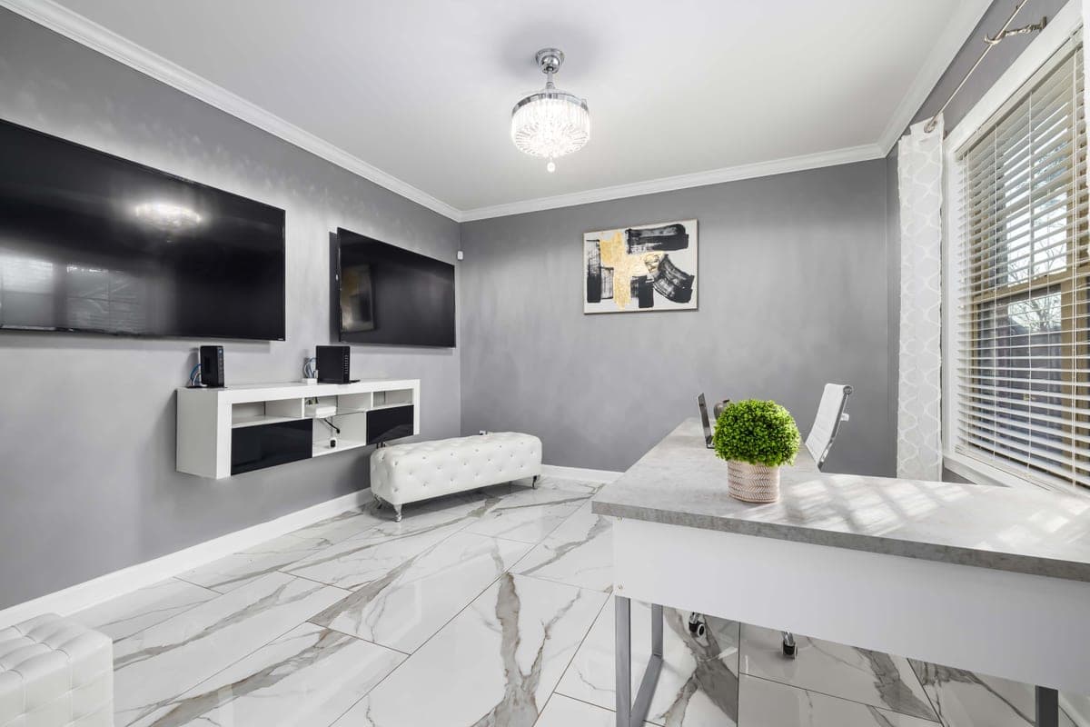 A large television mounted on a living room wall