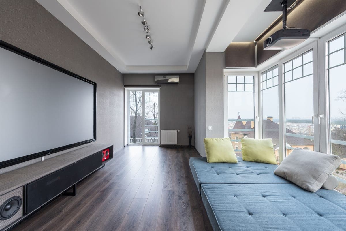 A very large television on a living room wall