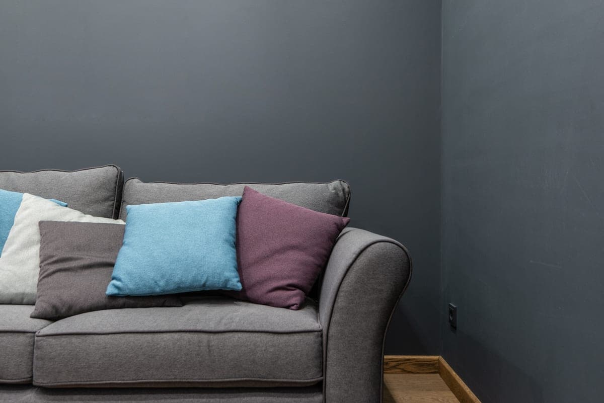 The corner of a modern living room where two walls meet