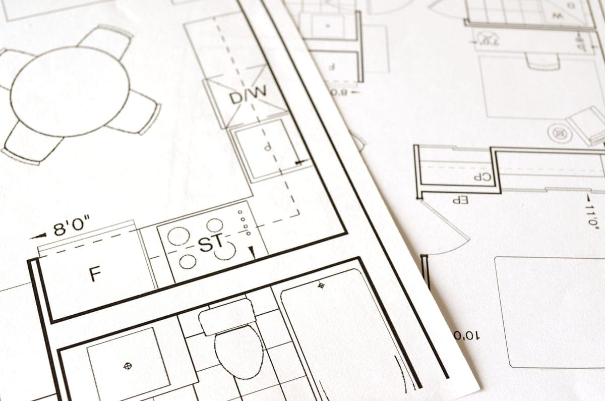Someone measuring furniture while planning a room