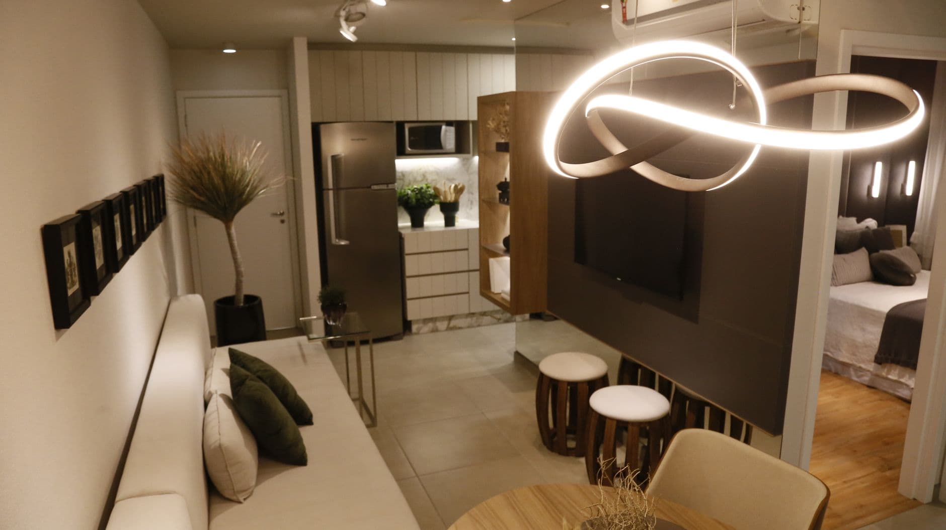 A compact modern living room with warm lighting