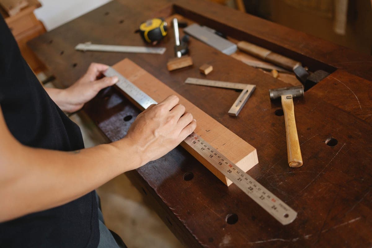 A ruler and measuring tools on a workshop bench