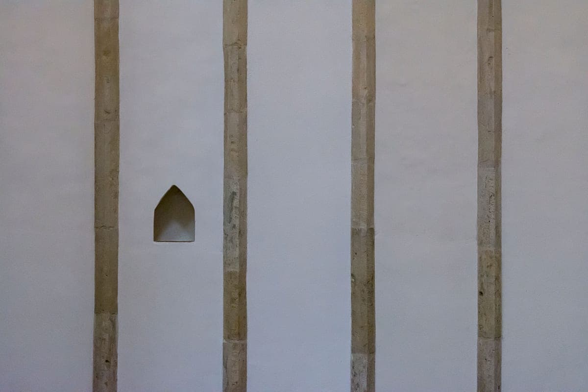 A recessed alcove in a plain interior wall